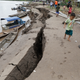 The banks of the Huallaga River are cracked after an earthquake in Puerto Santa Gema, on the outskirts of Yurimaguas, Peru, Sunday, May 26, 2019.